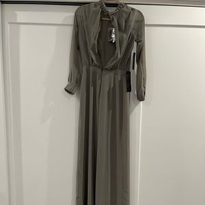 Grey BeBe jumpsuit , size 4 , brand new with tag .